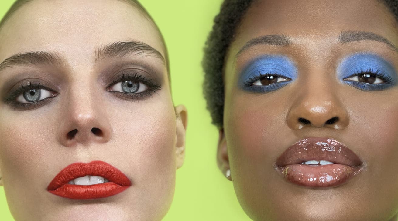 Close-up of two models showcasing the Full Beat makeup service, a flawless, bold look